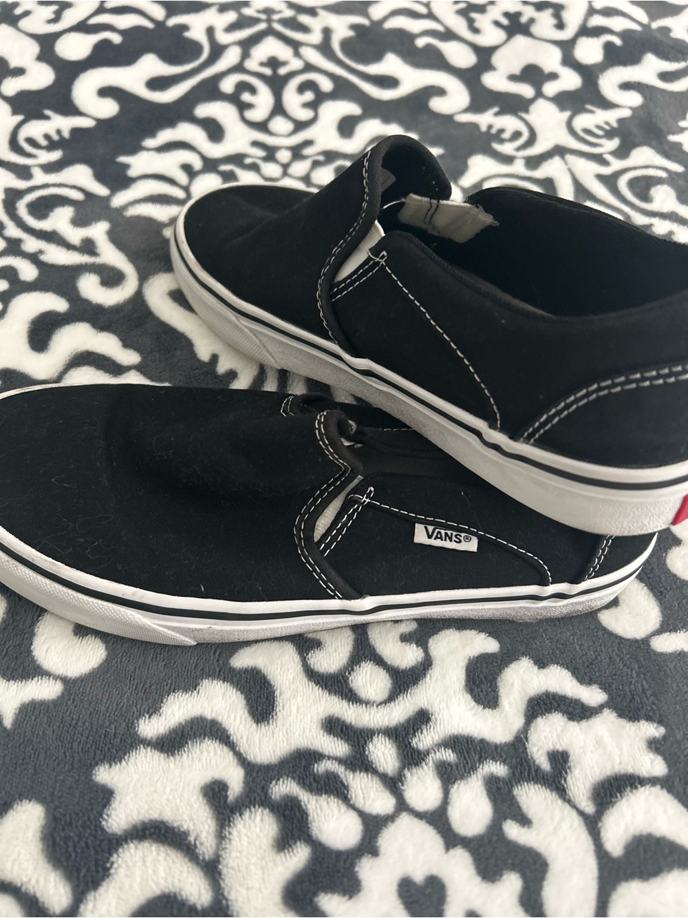Vans  Black Slip-On Sneakers with White Trim - women’s 8.